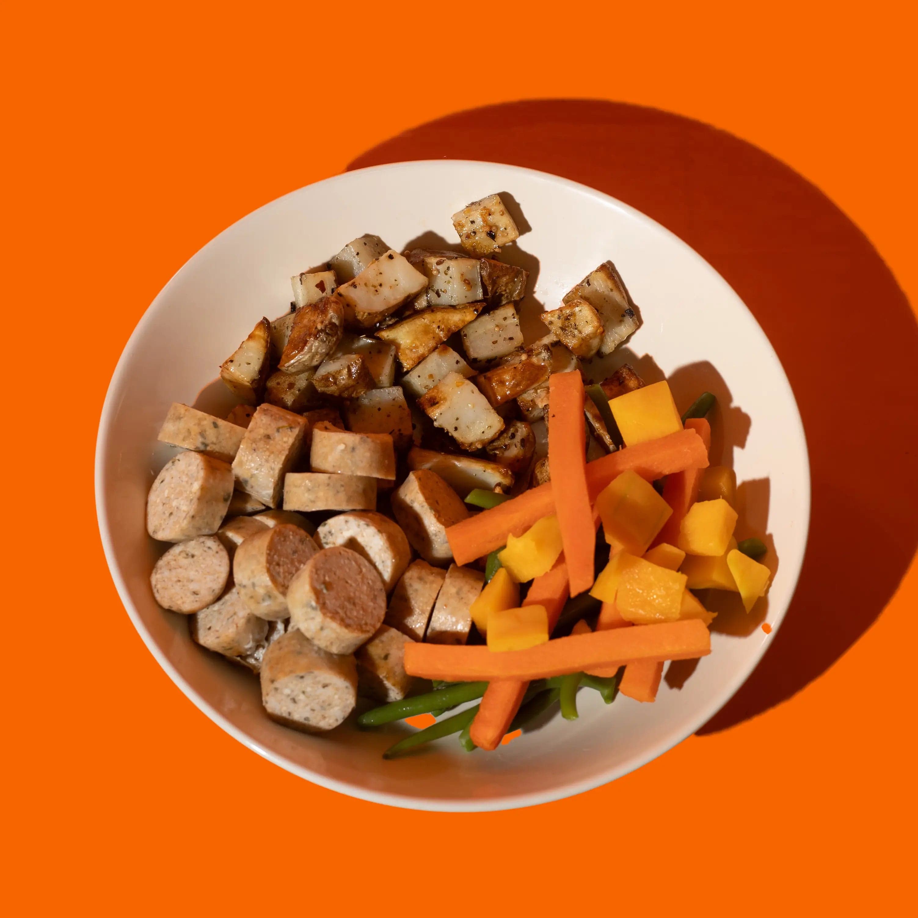 Saucisses de poulet artisanales signées Big Mig, une option de repas préparé savoureuse et saine pour vos dîners rapides.